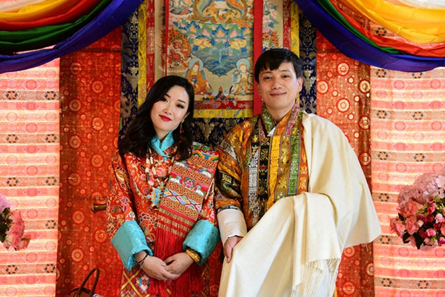 Tour guides wearing the Gho, the traditional national Bhutanese dress for  men. Tashichho Dzong, Thimphu, Bhutan Stock Photo - Alamy